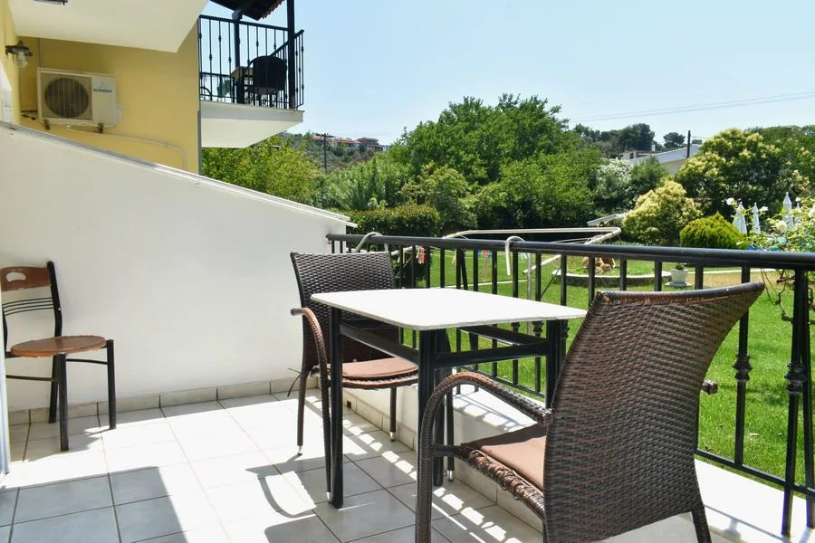 Balcony table with green views over Troulos